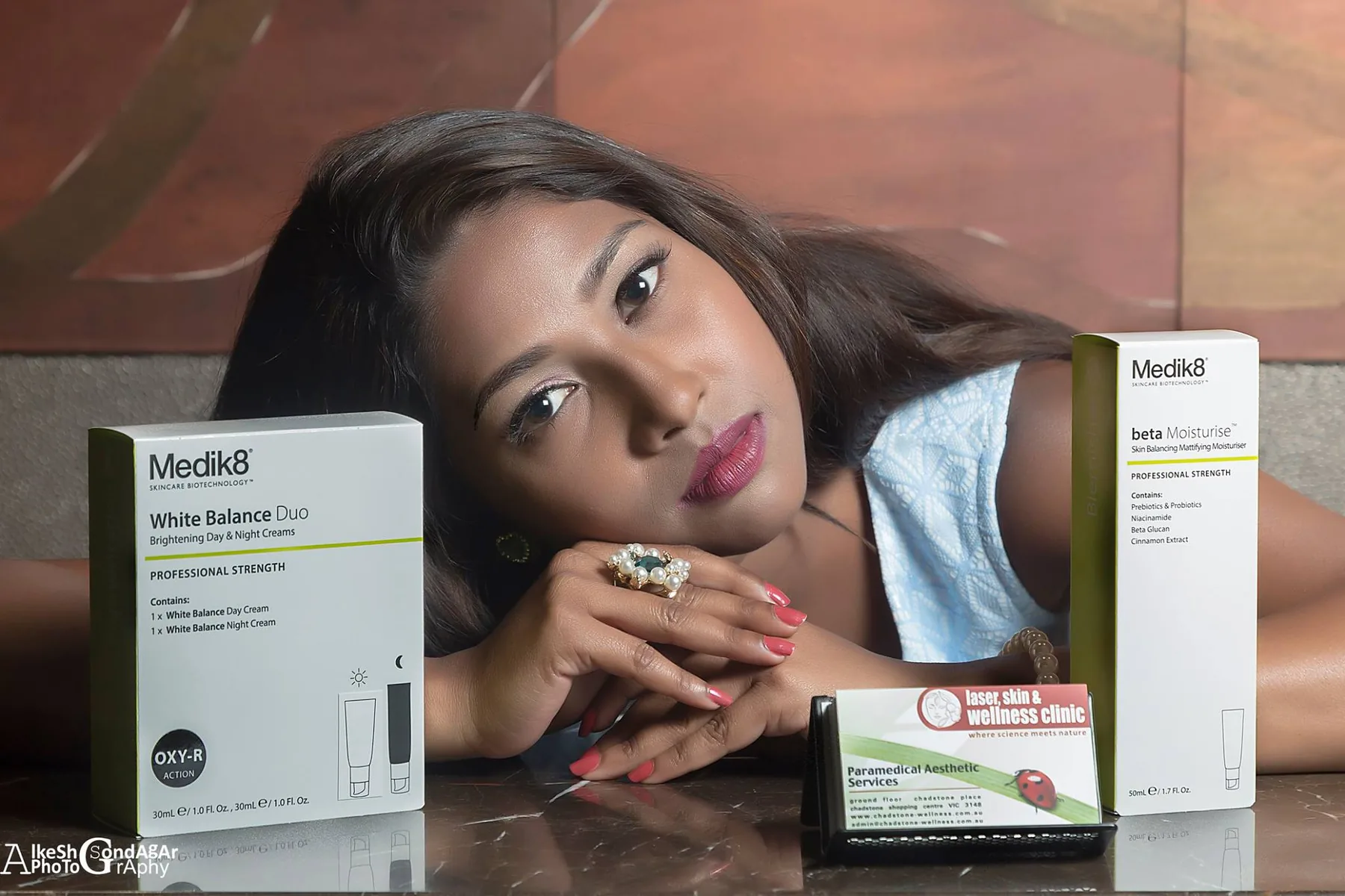 Commercial portrait composition with products